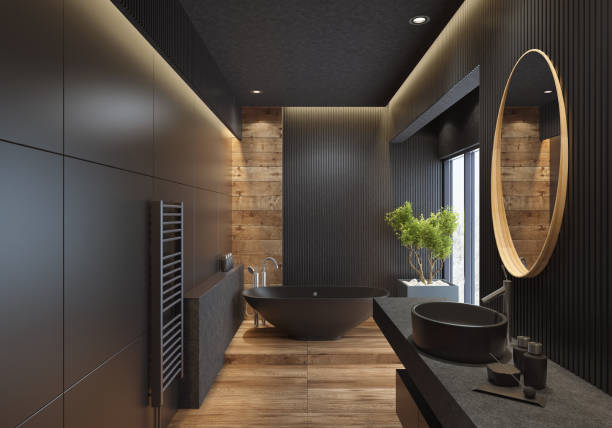 contemporary minimalist bathroom with black wooden walls and large grey matte and wood effect tiles. 
round mirror with wooden frame is on the wooden black wall. 
round grey stone washbasin and stainless steel basin tap is on top of the grey stone vanity unit with three drawers.
freestanding black stone bathtub and floor mounted inox tap is on a platform with wood effect tiles. 
long floor tiles with wood effect. black ceiling with strip cove lighting and embedded spotlights.

***background is my istock image
